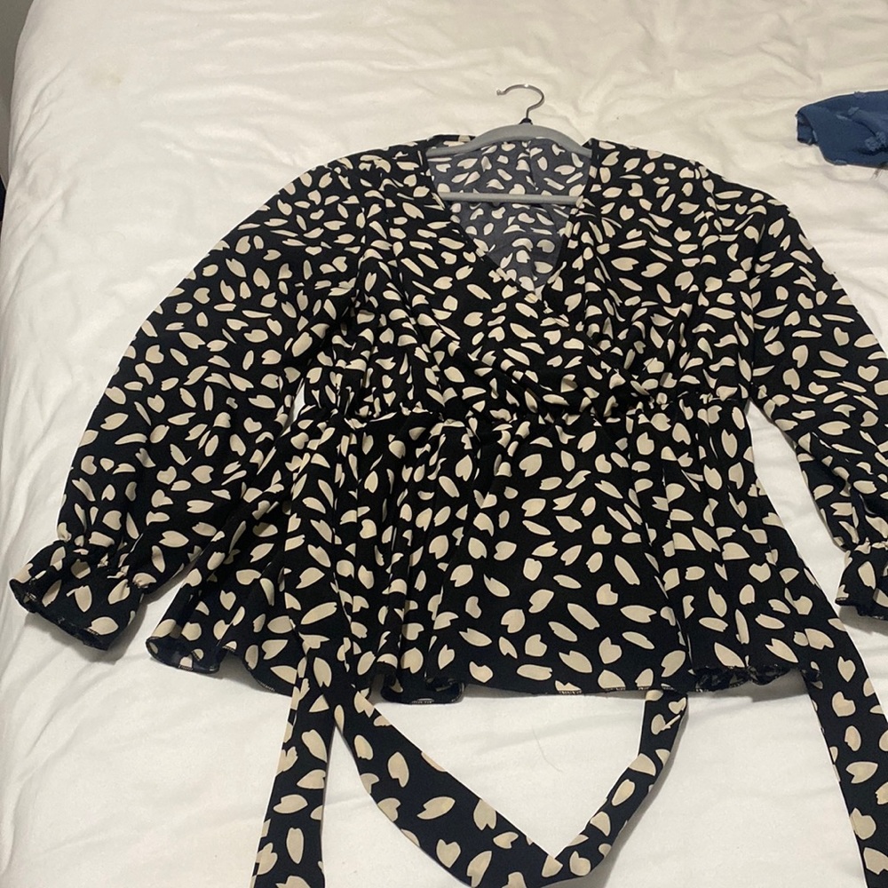 Leopard print, long-sleeve blouse from SHEIN. Has a tie. Not my style anymore.